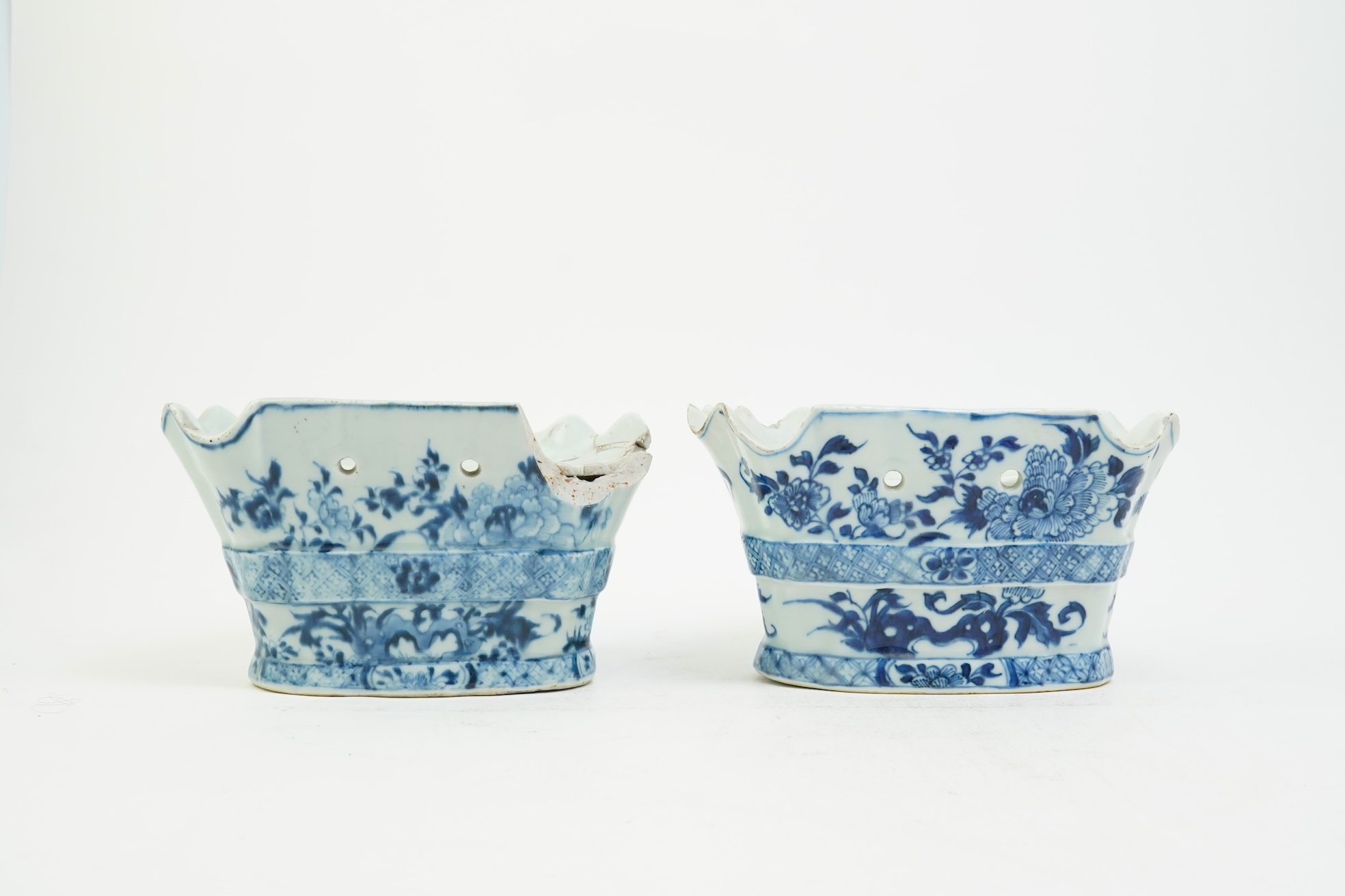 A pair of unusual Chinese export blue and white bough pots, after a Delft model, Qianlong period